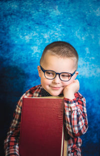 Portrait of boy with book