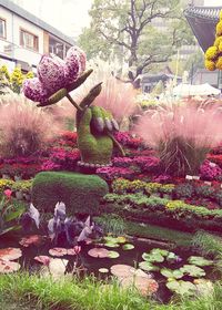 Statue of woman in garden