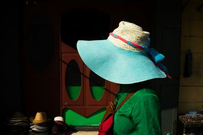 Close-up of young woman wearing hat