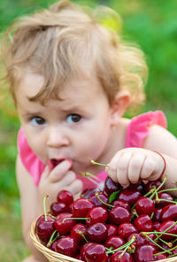 Close-up of cute girl eating food