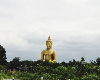 Low angle view of statue against sky