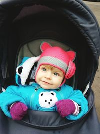 Portrait of cute baby girl with toy
