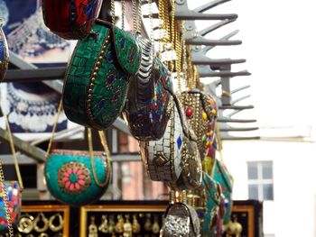 Multi colored umbrellas hanging in city