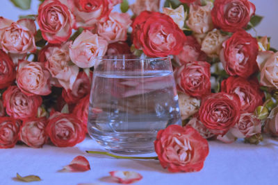 Close-up of red roses on table