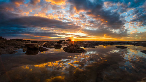 Scenic view of sea against cloudy sky