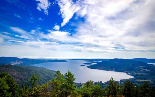 Scenic view of mountains against blue sky