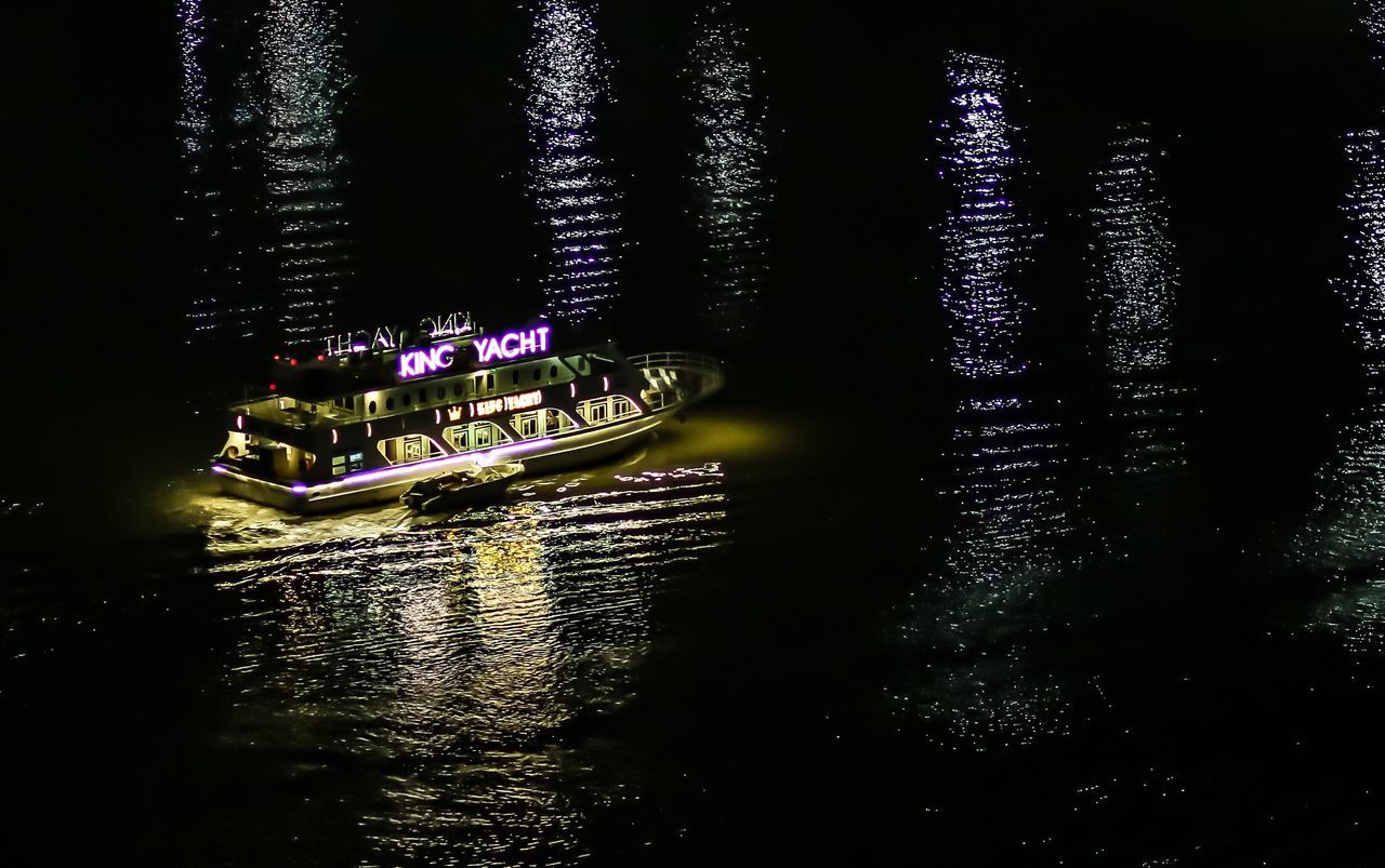 CLOSE-UP OF ILLUMINATED WATER WITH LIGHT REFLECTION IN LAKE