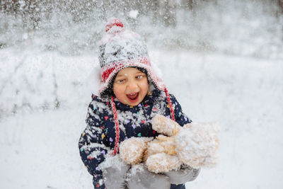 Portrait of happy girl in snow