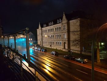 Cars moving on illuminated city at night