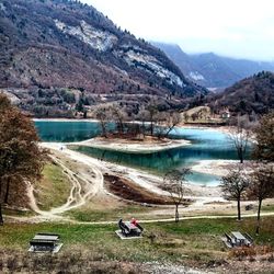 Scenic view of lake and mountains against sky