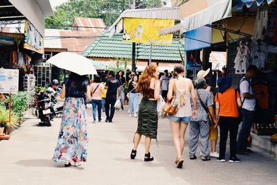 People walking on street in city