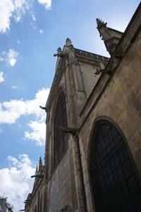 Low angle view of cross against sky