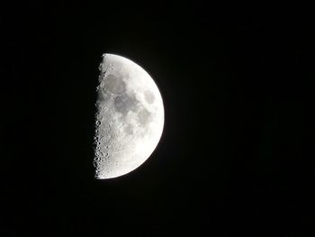 Low angle view of moon against sky at night