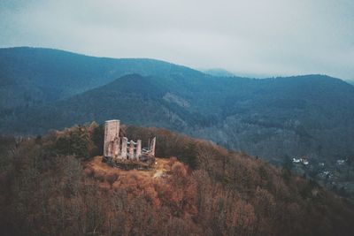 High angle view of building and mountains against sky