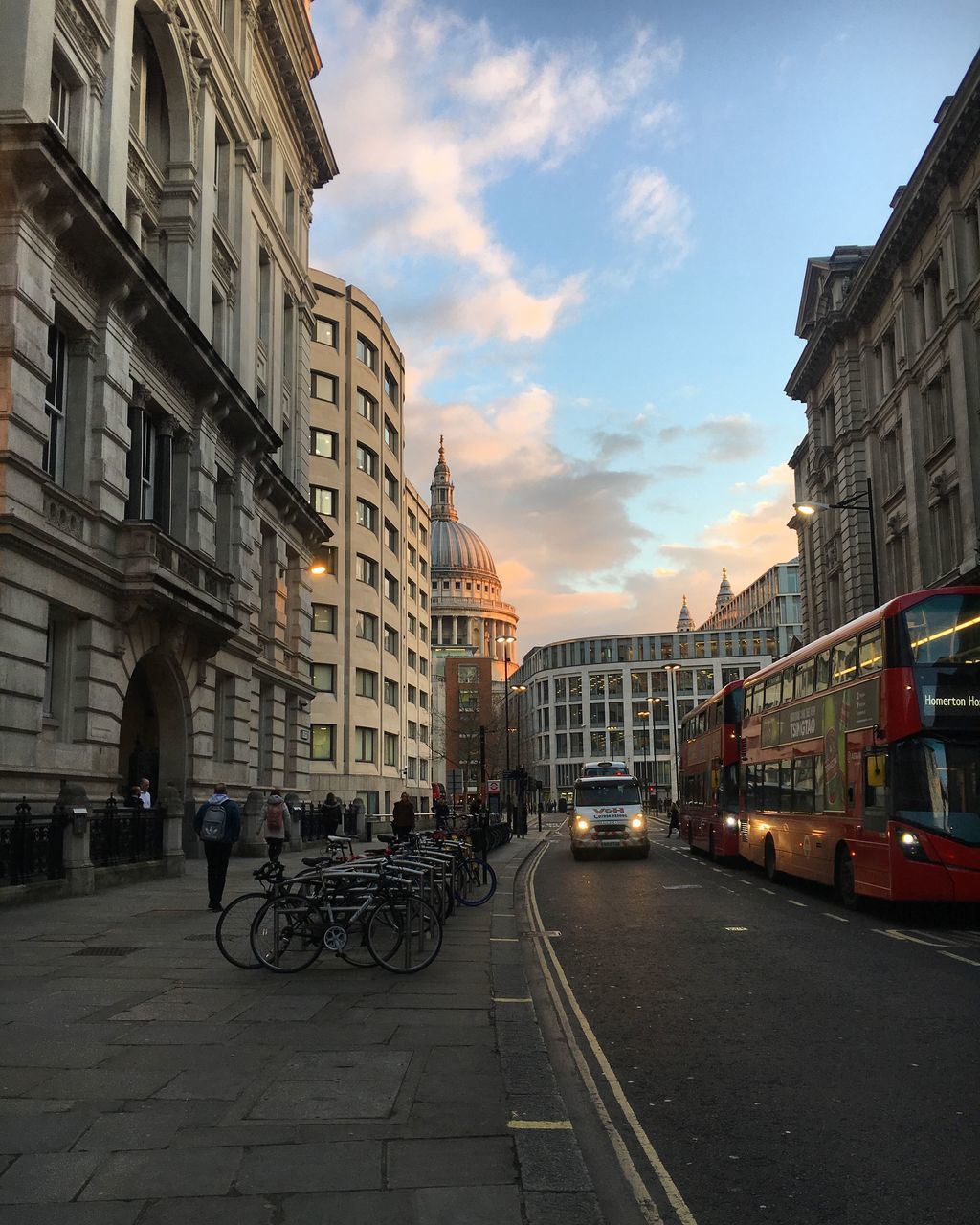 VEHICLES ON ROAD AGAINST SKY