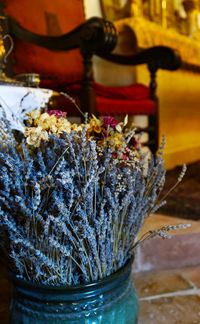 Close-up of flower pot on table at temple