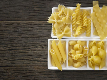 Close-up of colorful fusilli pasta in container on table