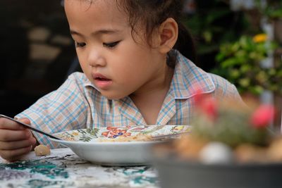 Close-up of boy eating food