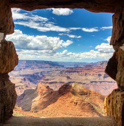 Scenic view of landscape against cloudy sky