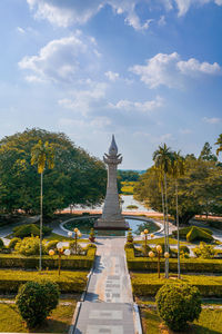 View of temple building against cloudy sky