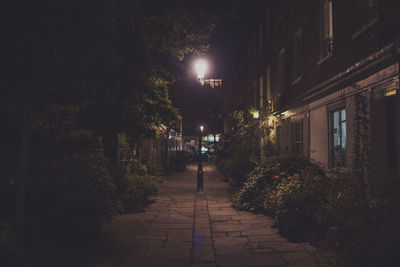 Illuminated walkway at night