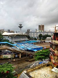 High angle view of street amidst buildings against sky