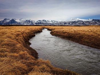 Scenic view of frozen lake against sky