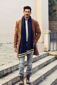 Portrait of young man standing outdoors