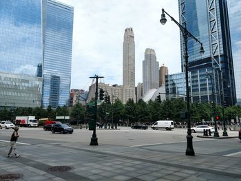 City street and modern buildings against sky