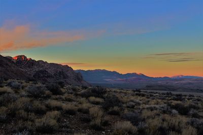 Scenic view of mountains against sky at sunset