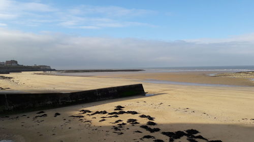 Scenic view of beach against sky