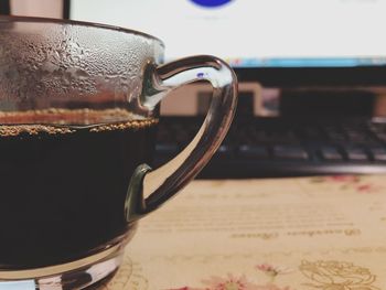 Close-up of coffee cup on table