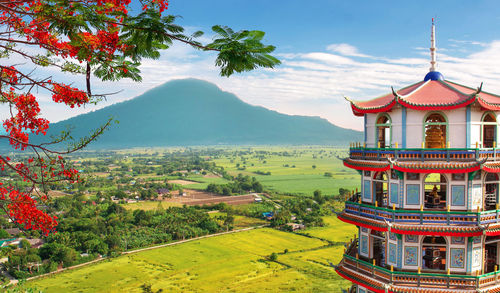 View of temple on building against sky