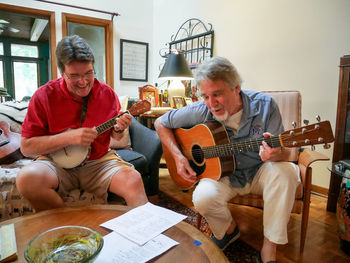 Men playing guitar at music concert