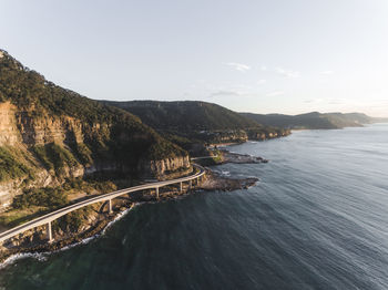 High angle view of coastal feature against clear sky