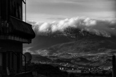 Mountain range against cloudy sky