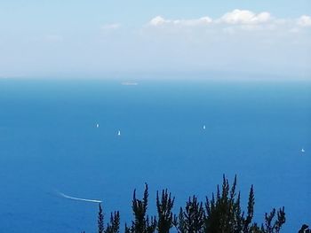 Scenic view of sea against blue sky