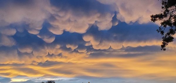 Low angle view of clouds in sky during sunset