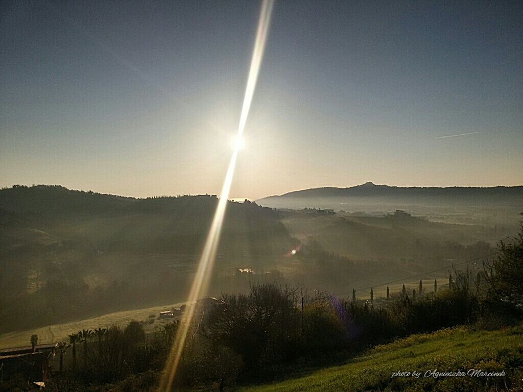 sun, mountain, tranquil scene, sunbeam, tranquility, scenics, sunlight, landscape, lens flare, beauty in nature, clear sky, mountain range, nature, non-urban scene, idyllic, sunny, bright, field, copy space, sky