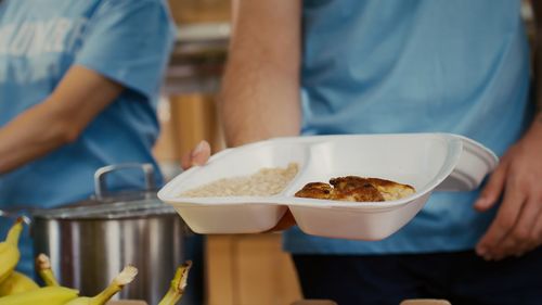 Midsection of man preparing food