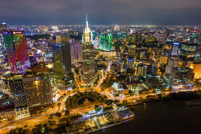 High angle view of illuminated city buildings at night