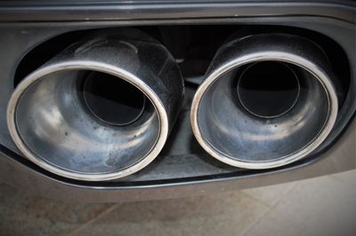 Cropped image of car exhaust pipe