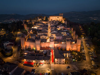 High angle view of illuminated buildings in city at night