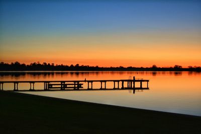 Scenic view of sunset over lake