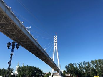 Low angle view of bridge against clear blue sky