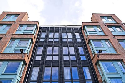 Low angle view of modern building against sky