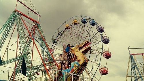 Low angle view of ferris wheel against sky