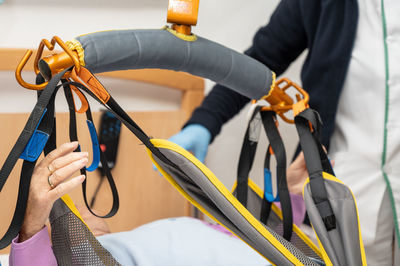 Midsection of man holding rope