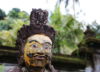 Close-up of statue against temple