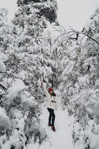 Man standing on snow covered field